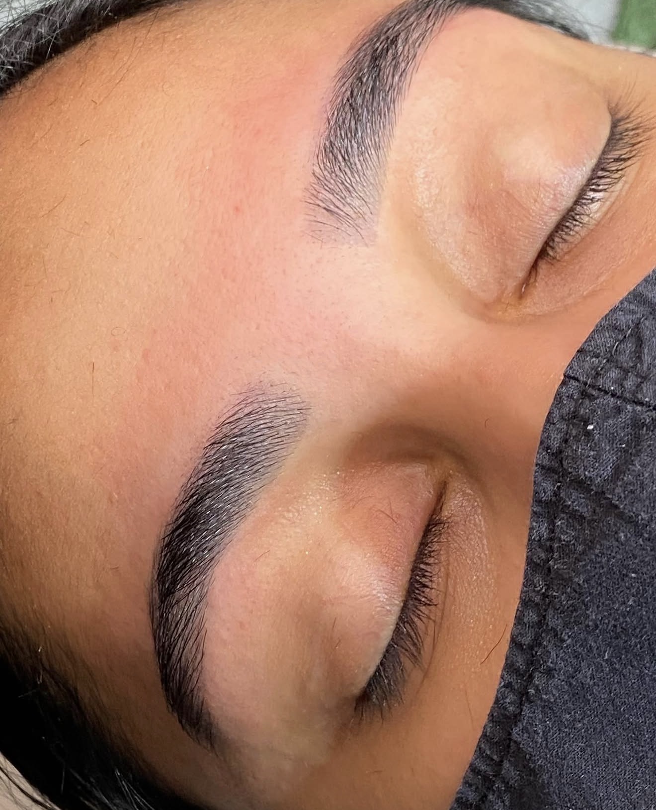 Freshly shaped and tinted eyebrows, close up